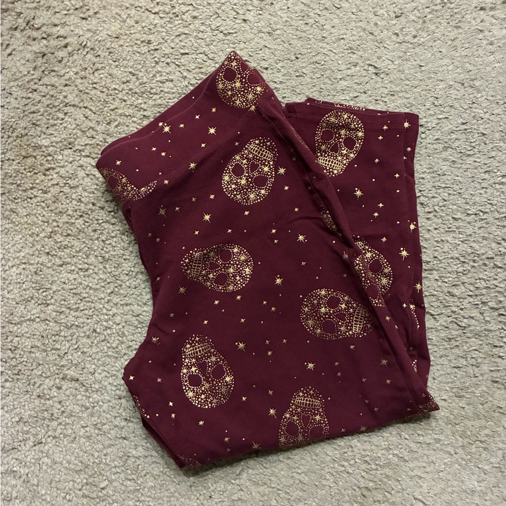 Torrid metallic skull leggings